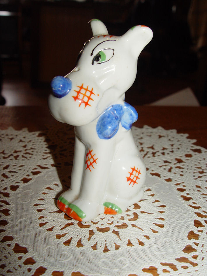 Hand
                                        Painted Oriental Dog Figurine
                                        with a Blue Bow Japan