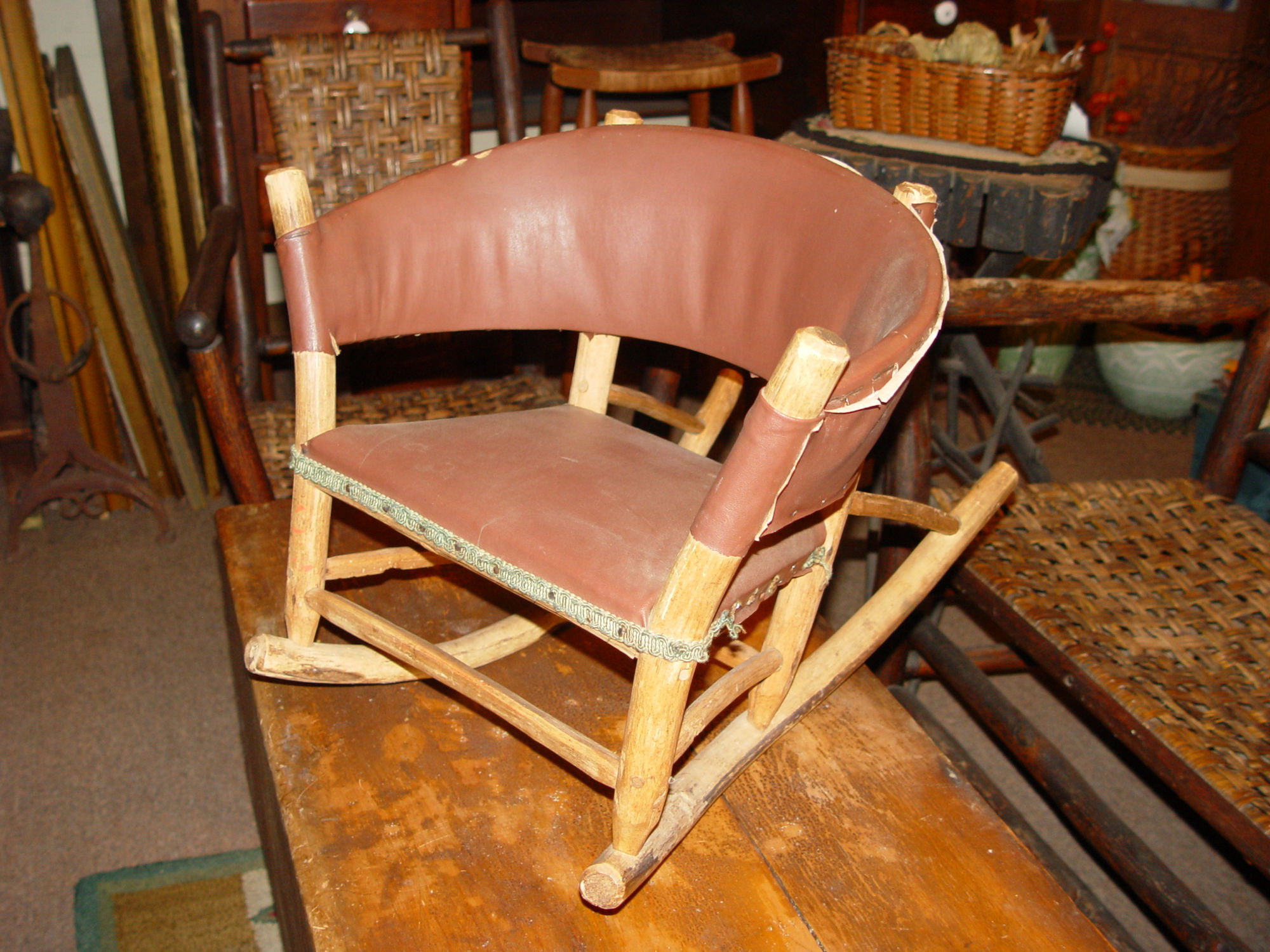 Early 20th
                        c. rustic child's woven handmade pegged, mortise
                        and tenon rocker