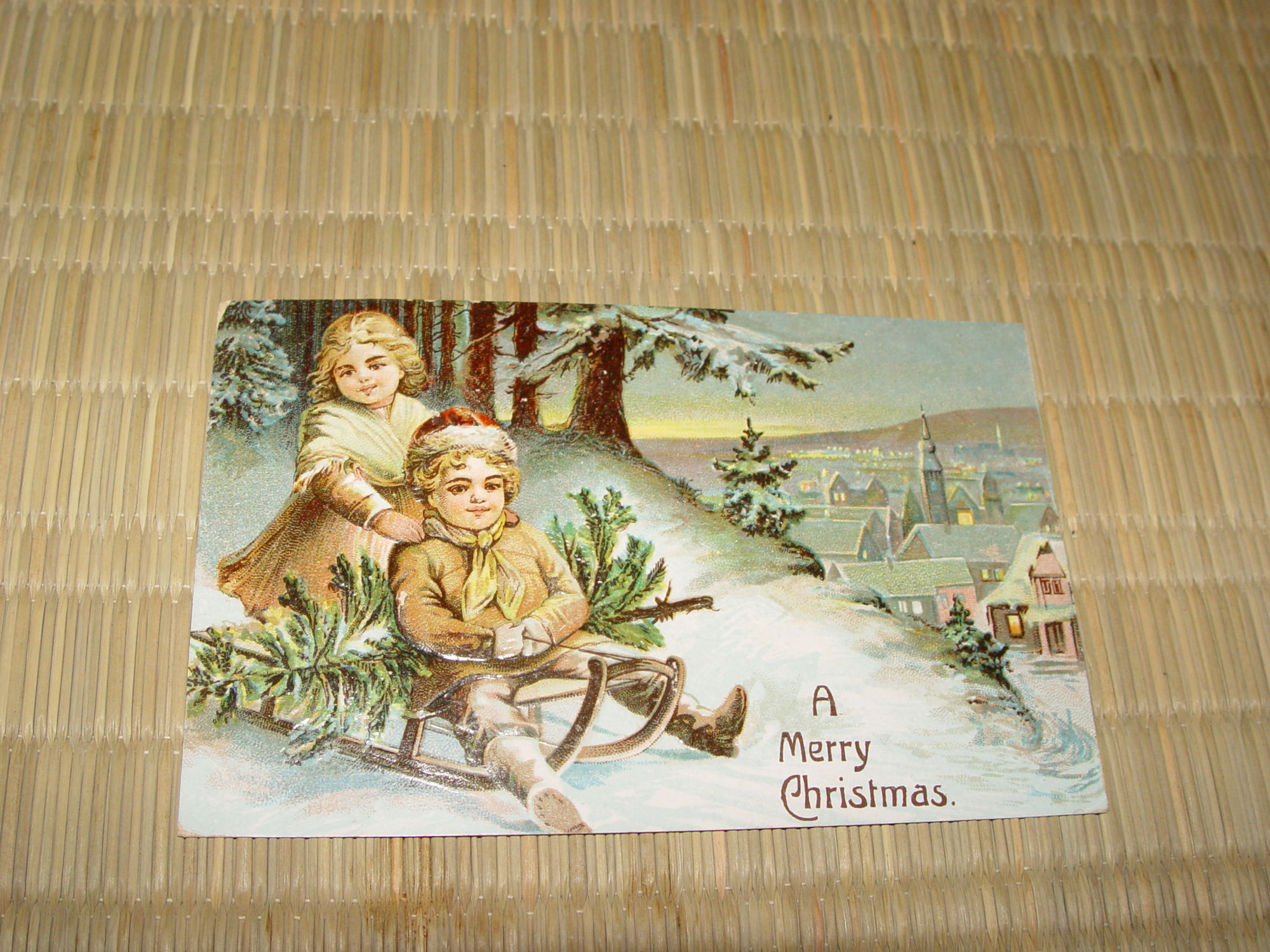 1908 German Christmas Antique Postcard, Children on
                Sleigh w/ tree