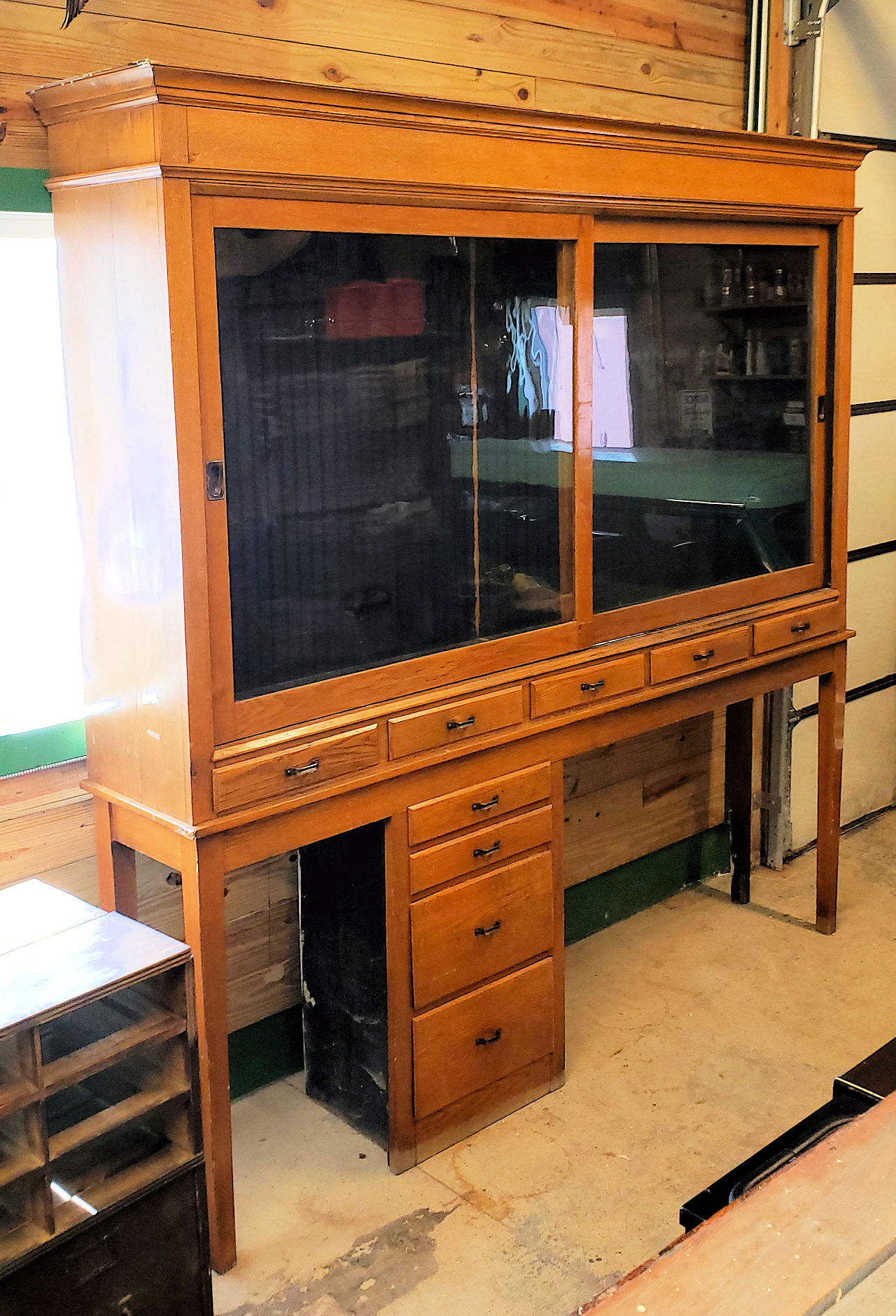 Early 20th c. Oak Display Store Cabinet with
Multi‑Drawer Base