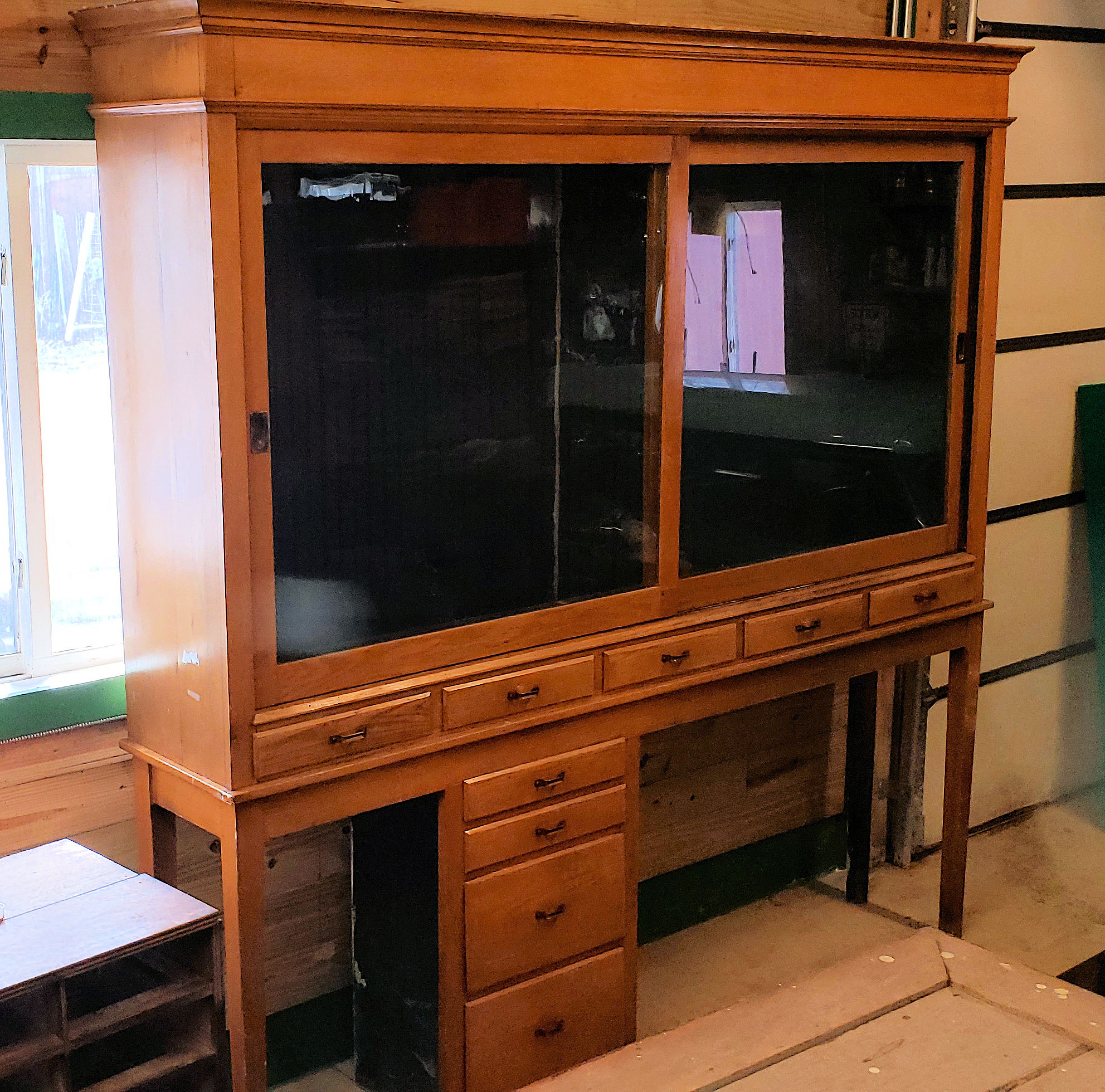 Early 20th c. Oak Display Store Cabinet with
Multi‑Drawer Base