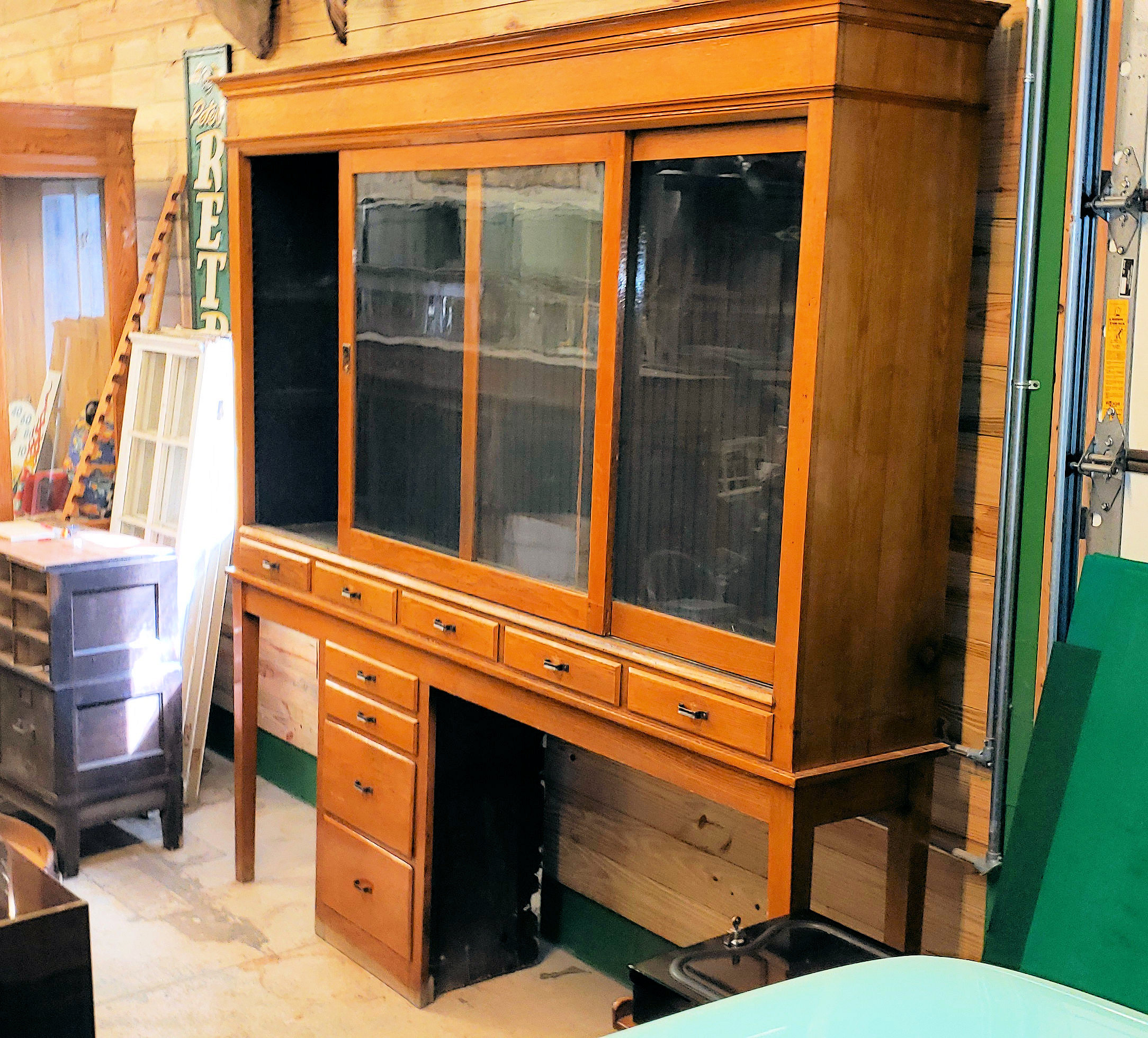 Early 20th c. Oak Display Store Cabinet with
Multi‑Drawer Base