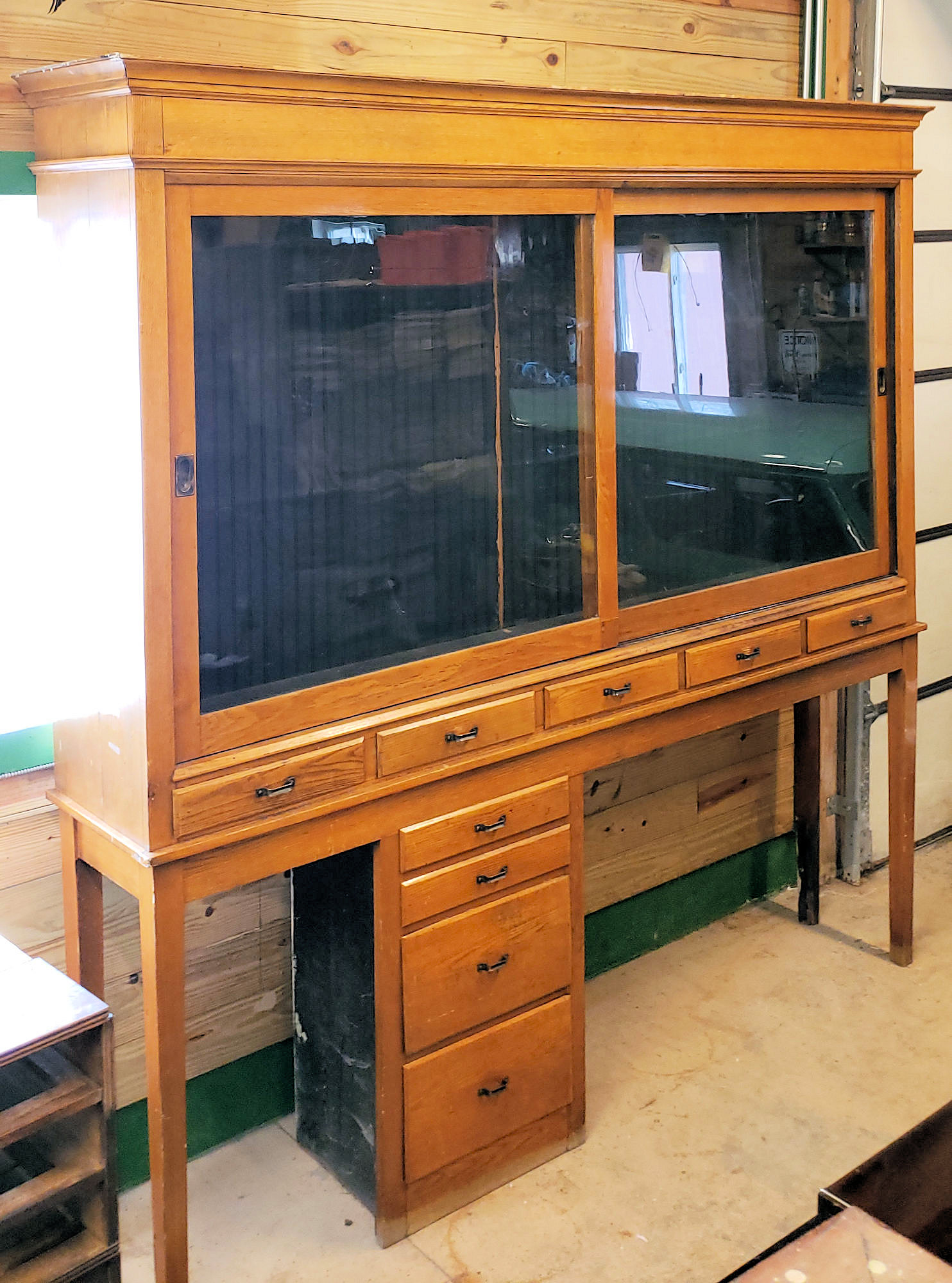 Early 20th c. Oak Display
and Storage Cabinet with Sliding
Glass Doors