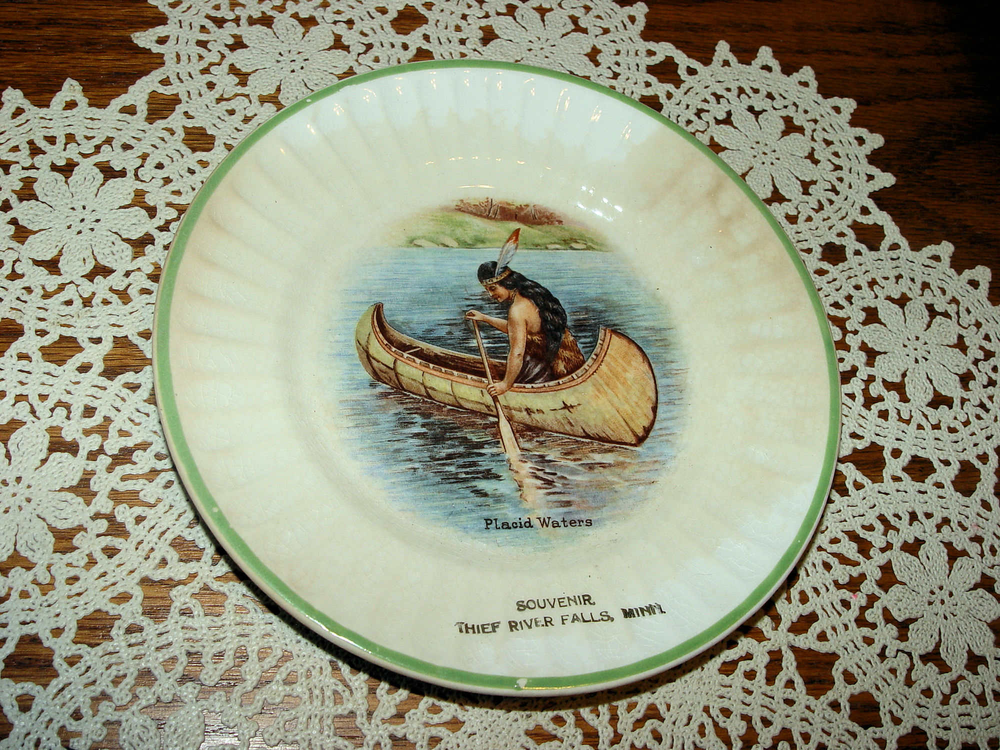 Thief river
                                        Falls MN Souvenir Plate, Placid
                                        Waters Indian Maiden in Canoe
