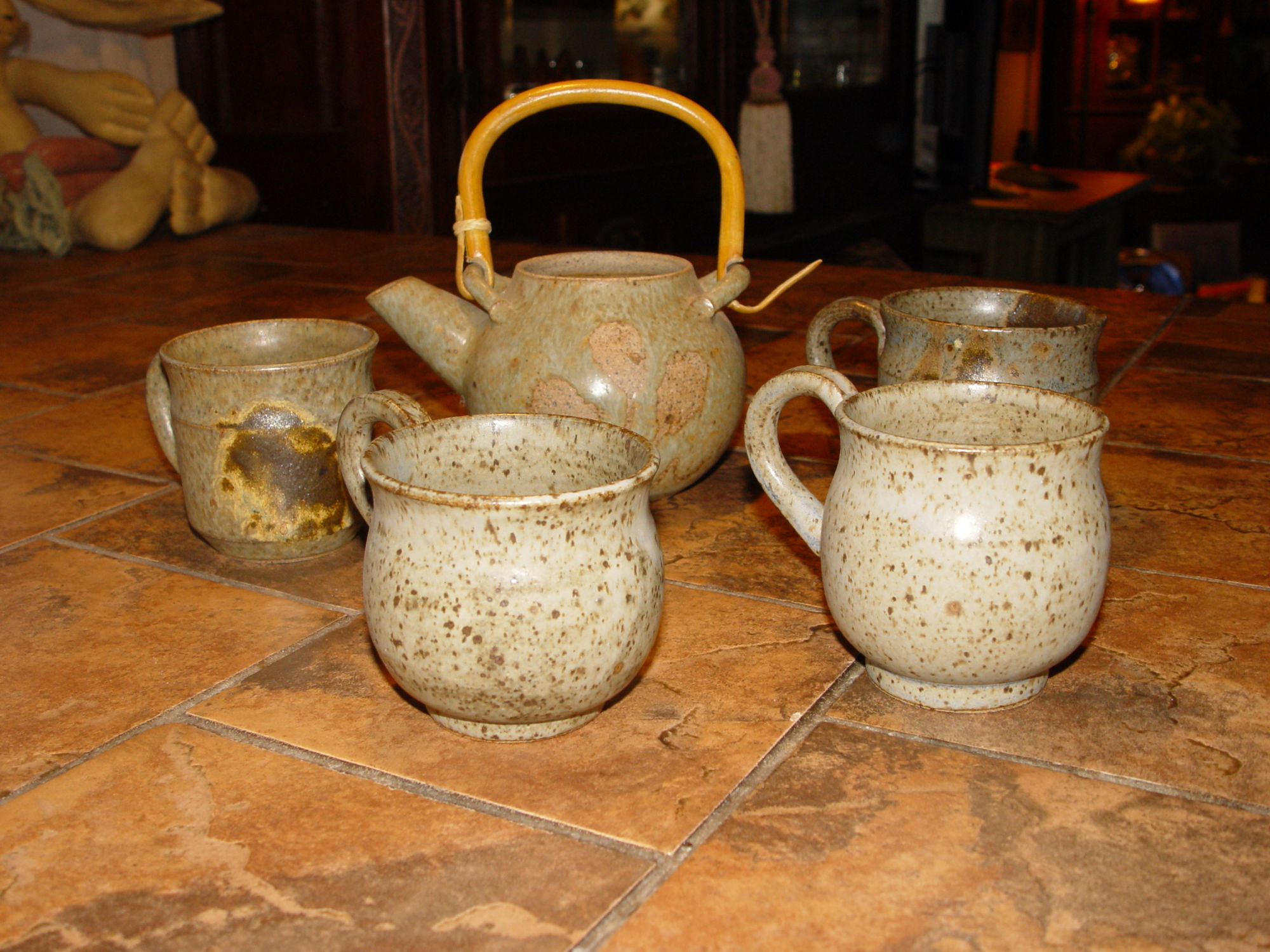 Vintage studio earthy
                                        ceramic teapot set with cane
                                        handle, impressed chop mark