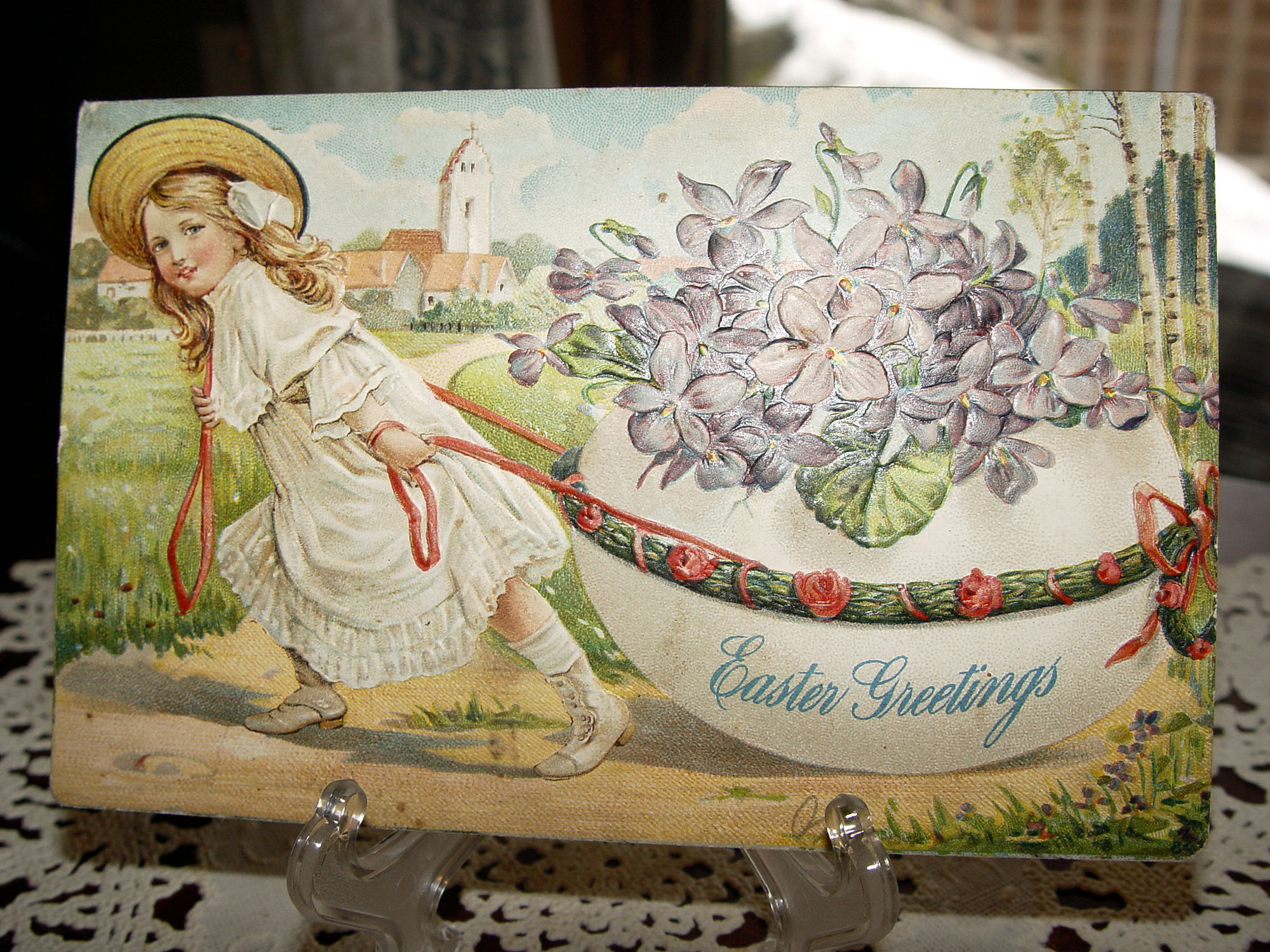Easter
                                                Antique Artist Postcard
                                                Victorian Girl Pulling
                                                Egg; Purple Violets
