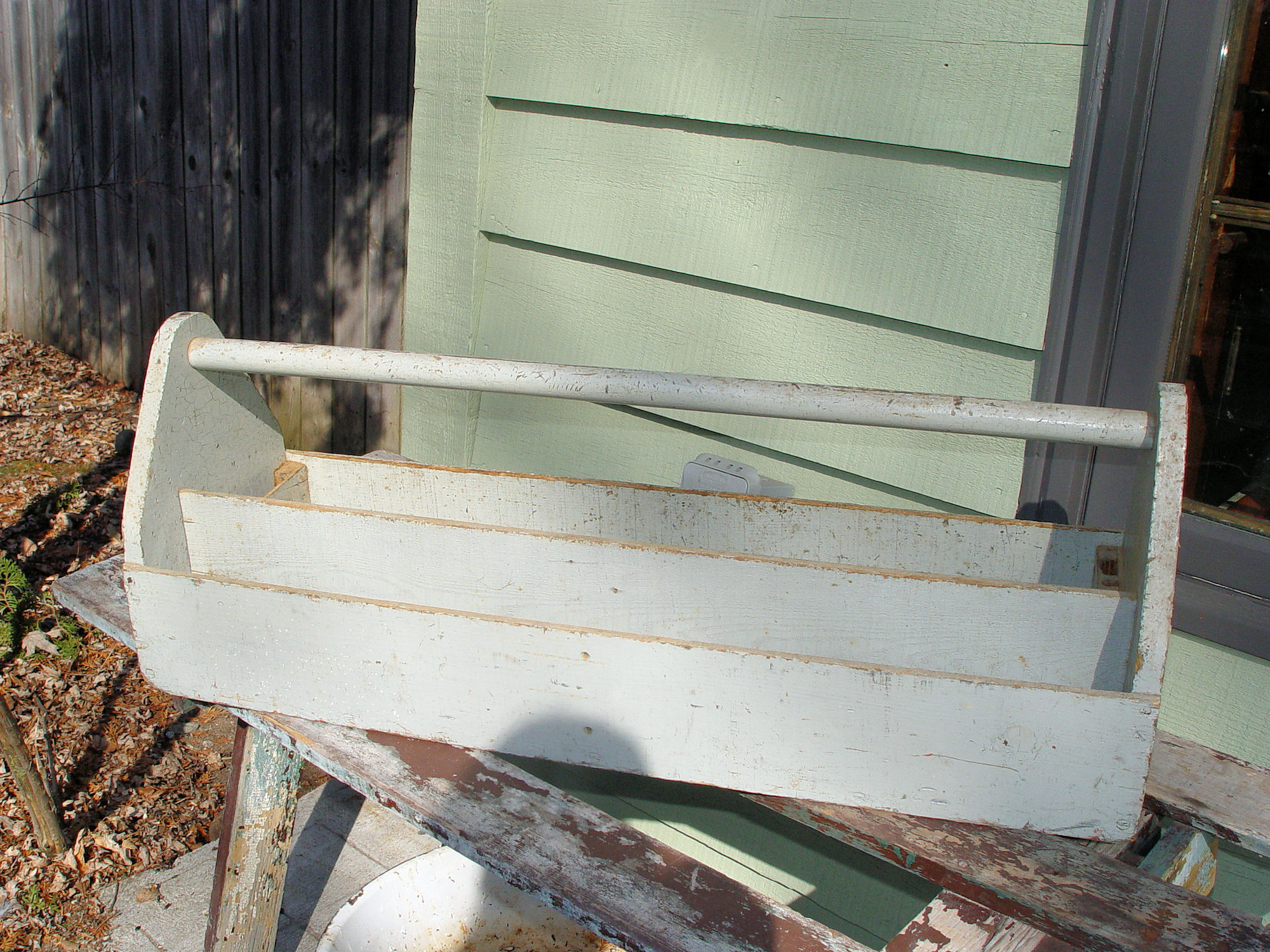 Primitive Painted Pine Wooden Inuit Fishing net
                Trough