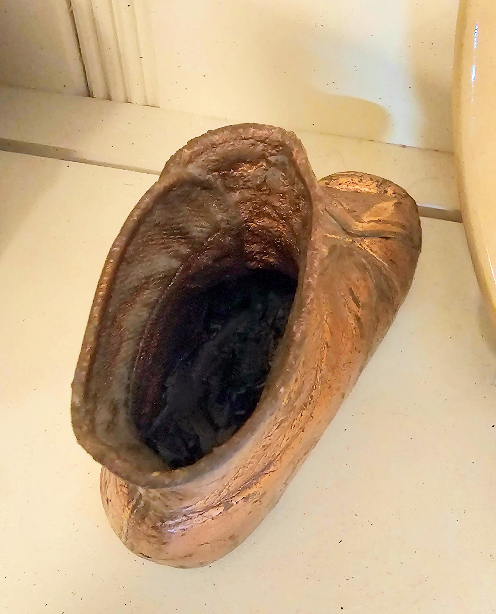 Antique bronzed copper coated Victorian button-up
baby shoe
