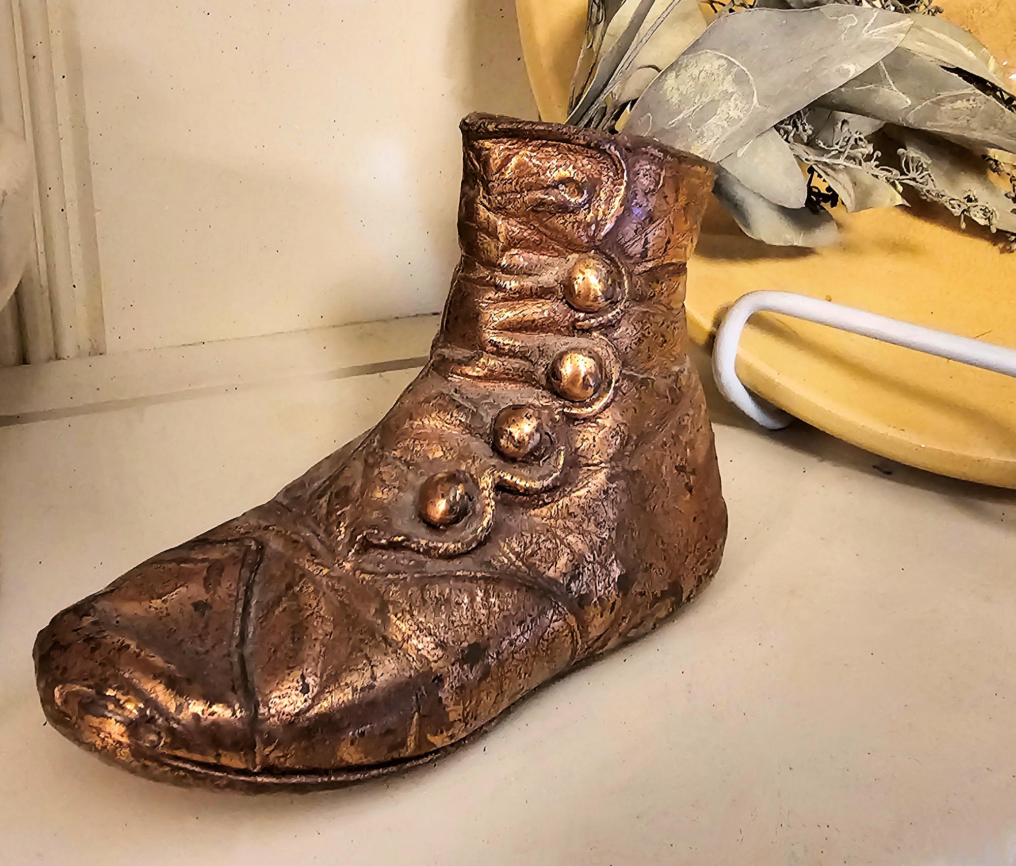 Antique
bronzed copper coated Victorian button-up baby
shoe