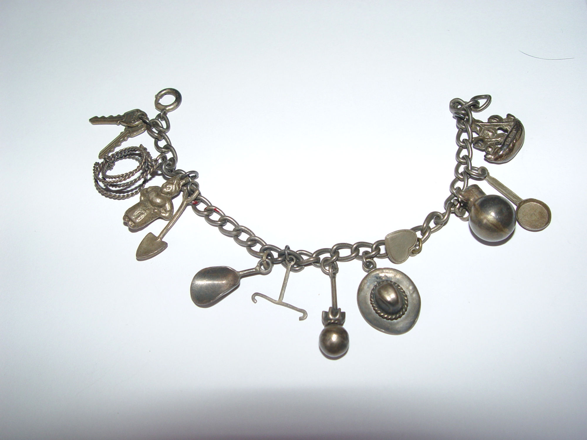 Silver Mexican Cowboy
                                        Western Gold Rush, Miner Charm
                                        Bracelet c. 1930's