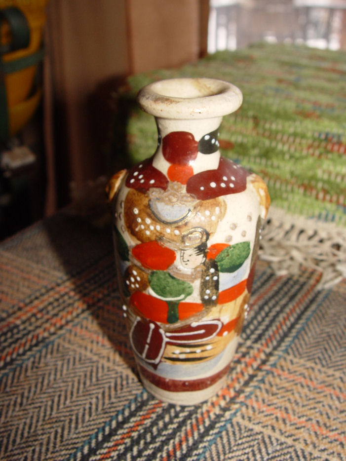 Japanese Earthenware
                                        Satsuma Bud Vase, Flowers,
                                        Elephants and Geisha
