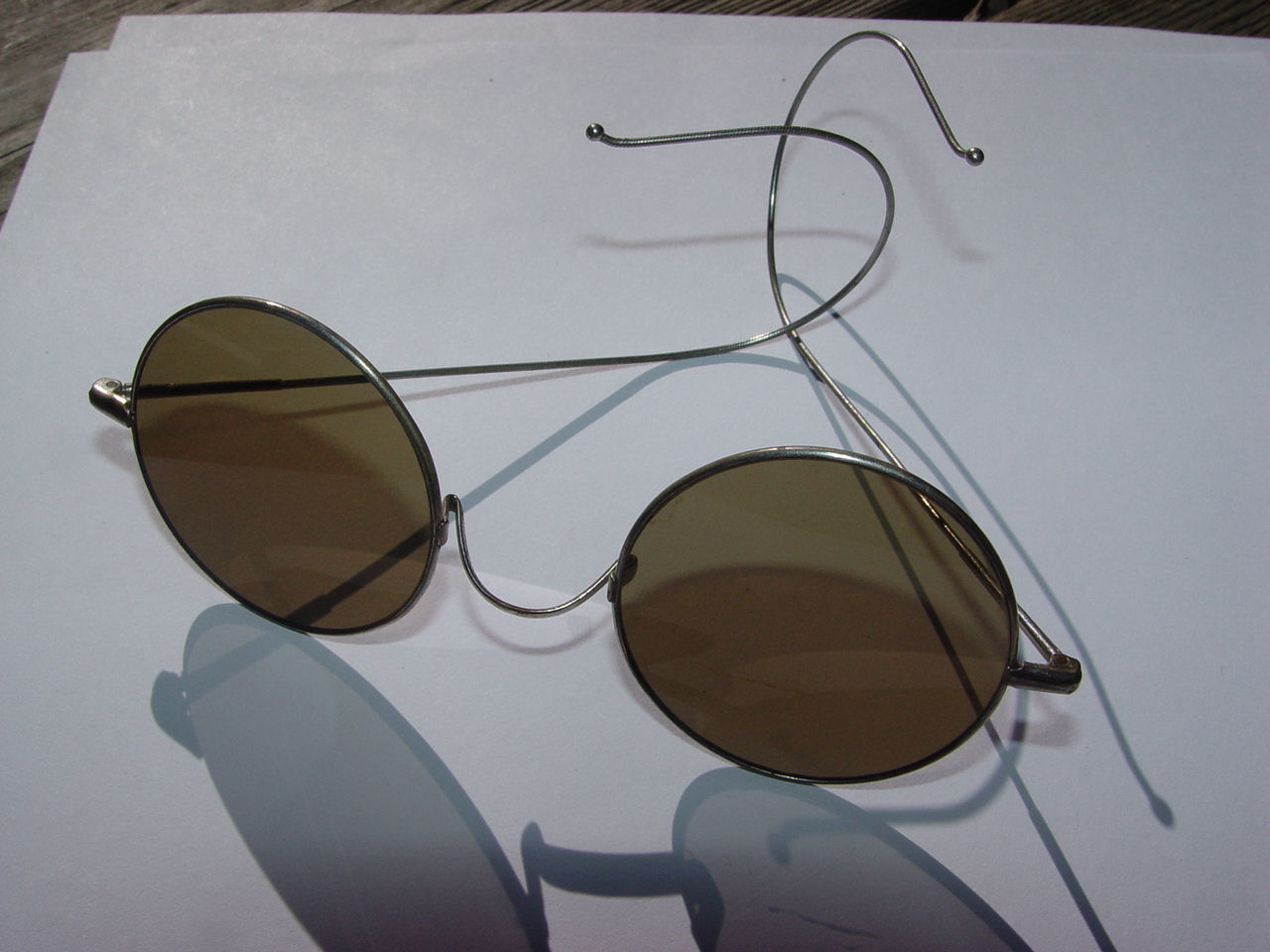 1920s Willson Sunglasses
                                        Green Lenses, Brass celluloid
                                        rimmed, Coil temples